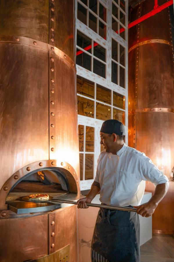 Nickelodeon Hotels & Resorts Riviera Maya Puerto Morelos Exterior photo A distillery worker checking the temperature of the mash